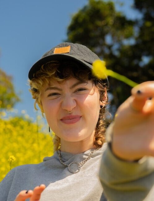 Portrait of a nonbinary autistic person outdoors